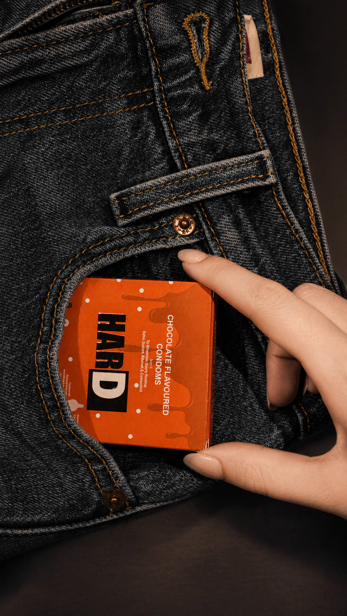 HARD product held against a denim pocket